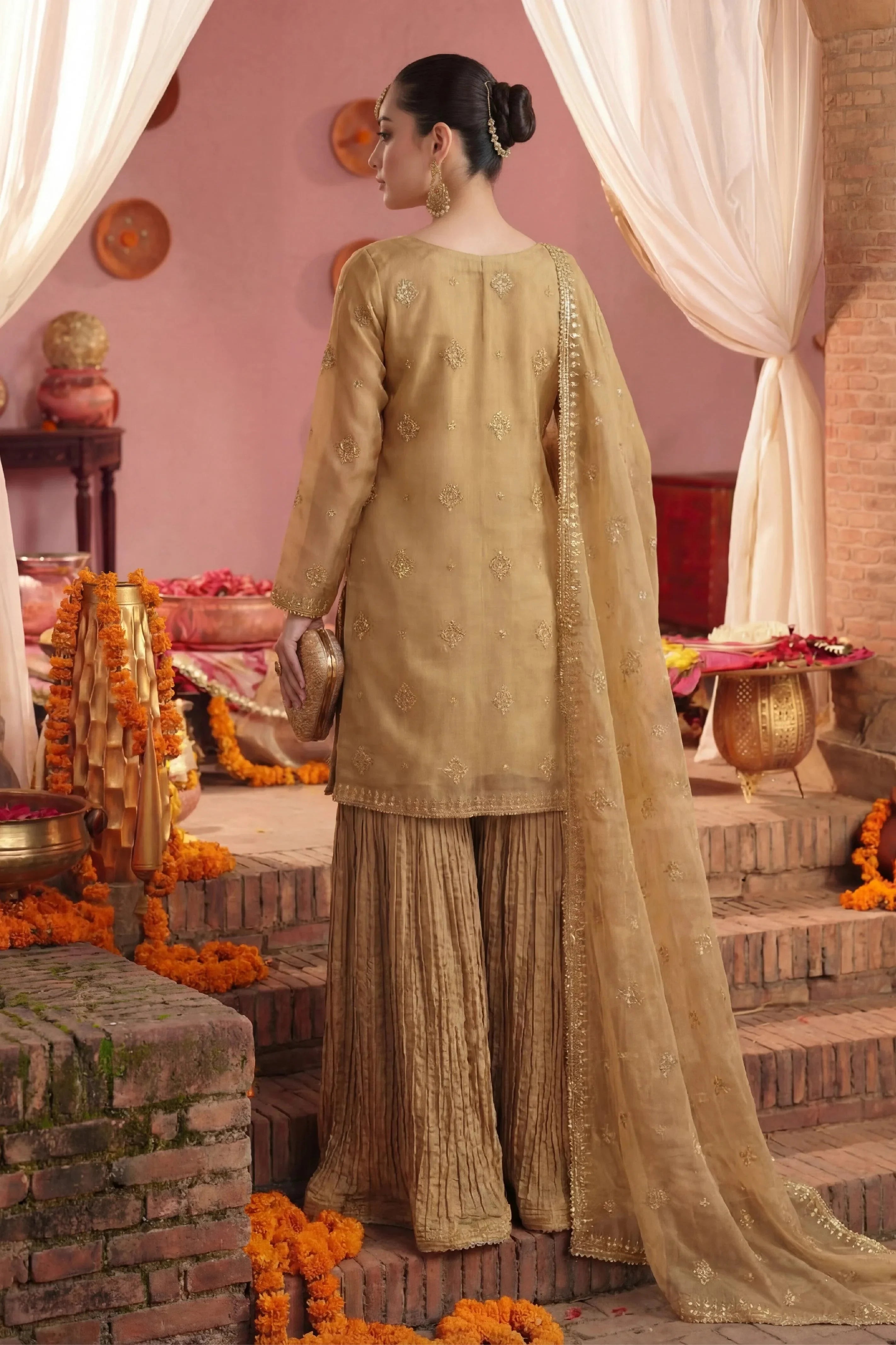 Elegant gold embroidered Pakistani dress with pleated trousers, perfect for weddings and special occasions