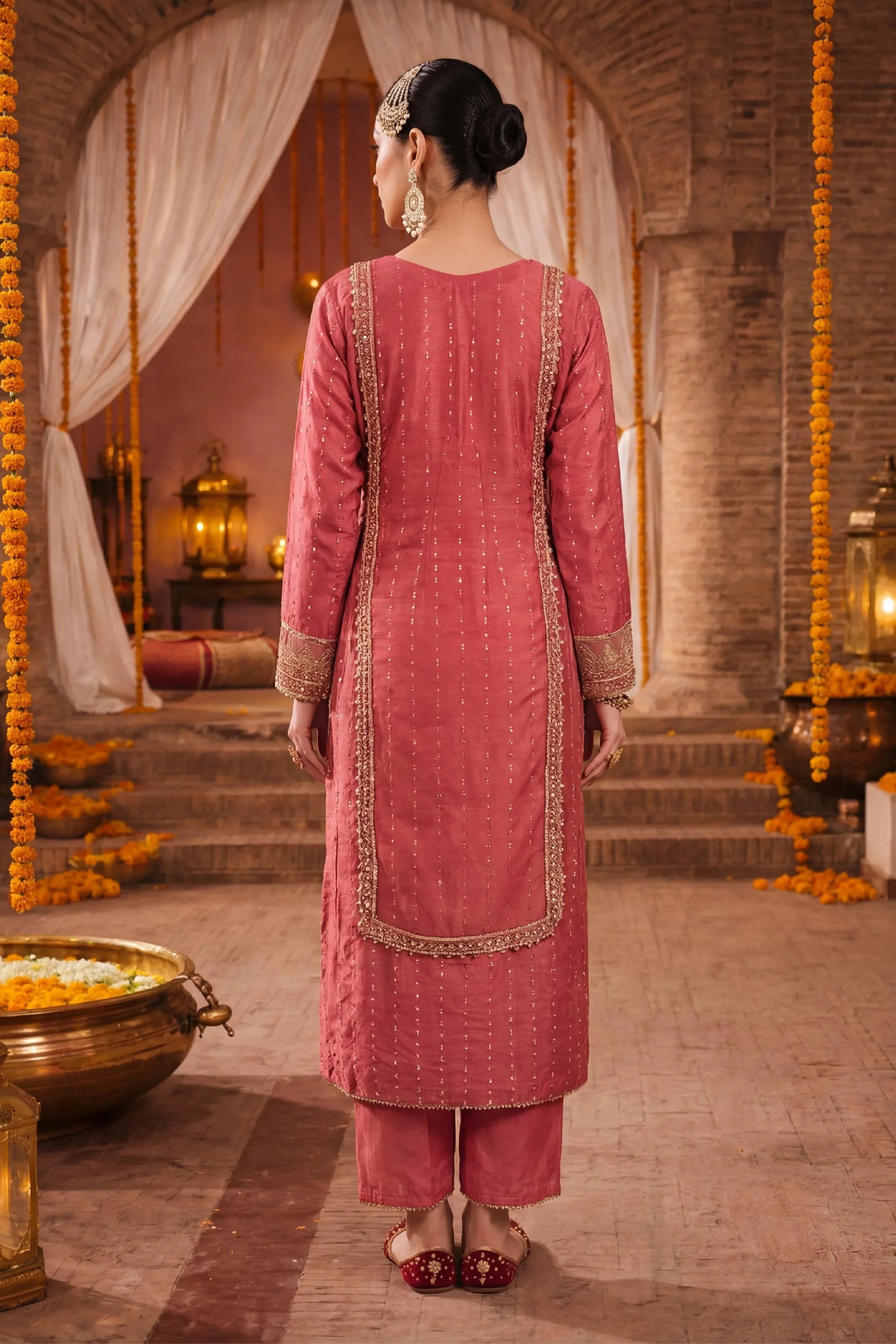 Elegant pink embroidered Pakistani dress with gold detailing, perfect for weddings and special occasions.