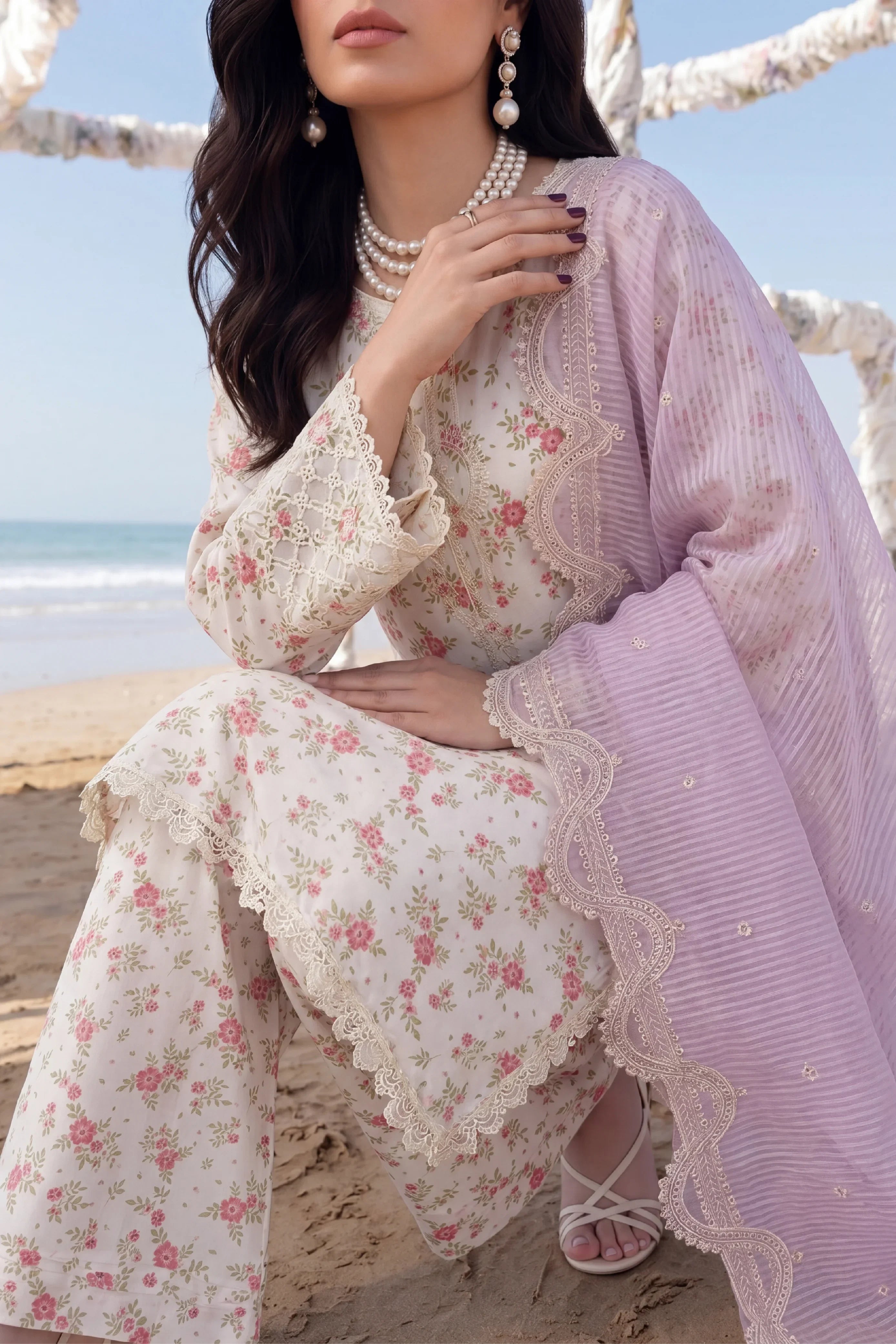 Floral printed Pakistani dress with lace detailing, paired with lavender dupatta, perfect for beach occasions.