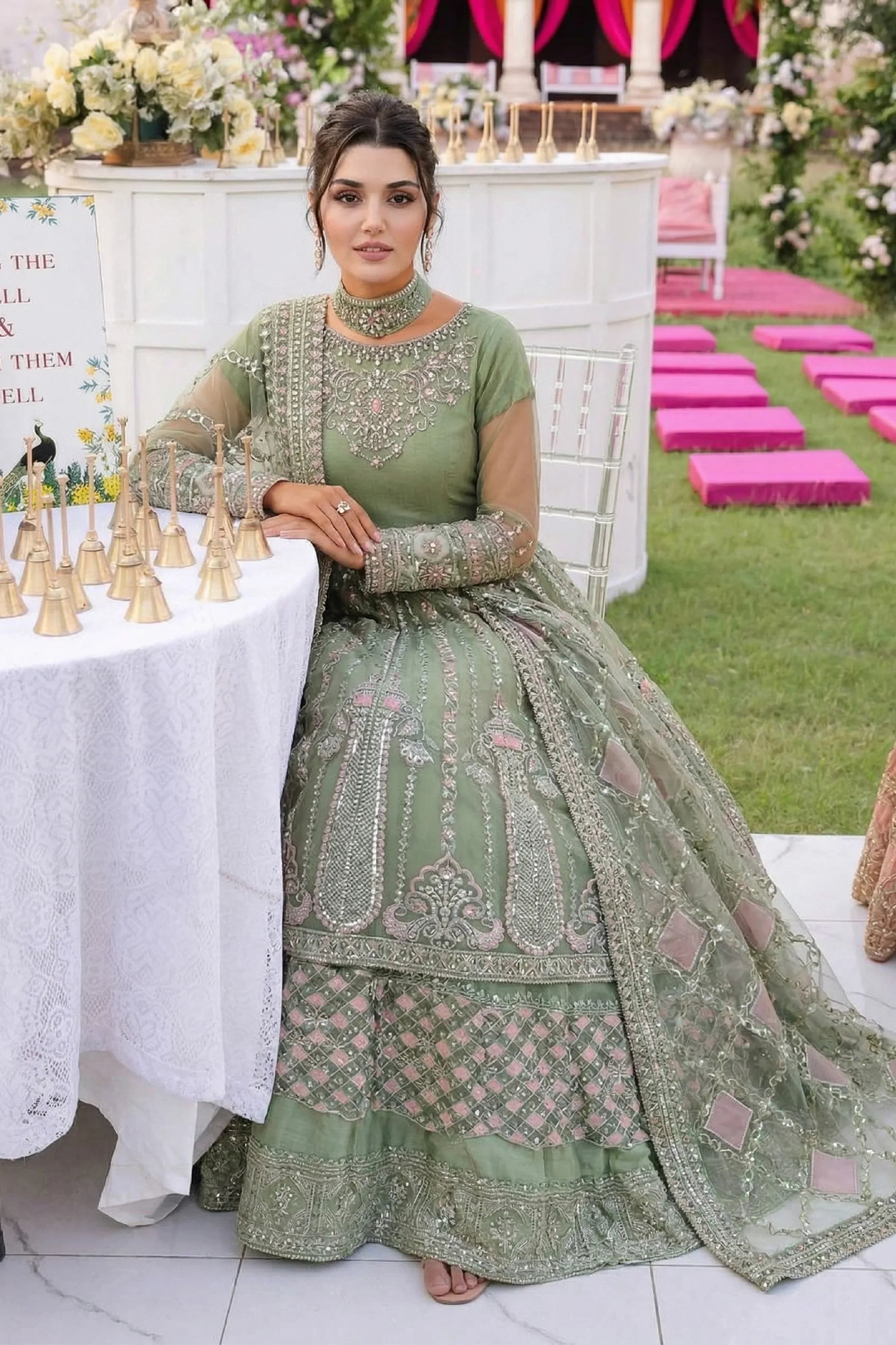 Elegant sage green embroidered Pakistani dress with intricate embellishments, perfect for weddings and special occasions.