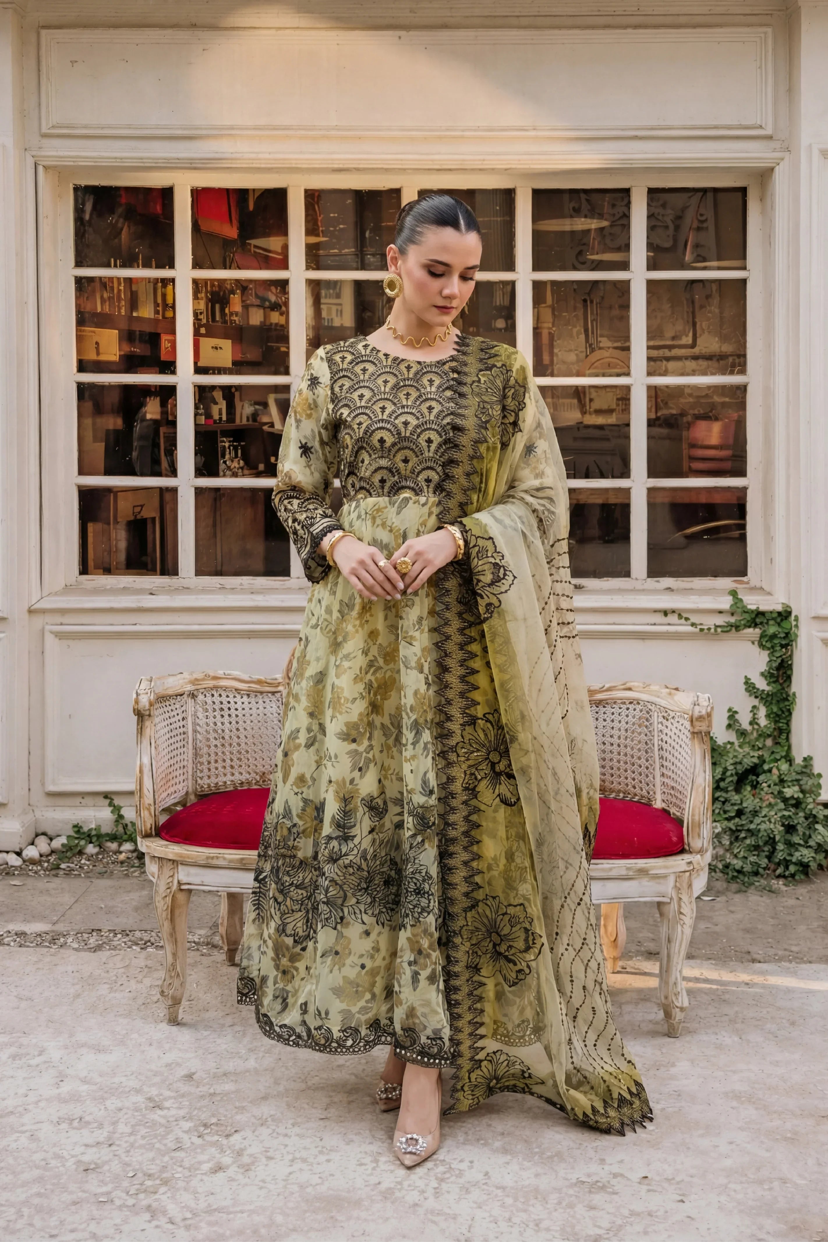 Elegant olive green floral embroidered dress with black detailing, perfect for formal occasions in Pakistan.
