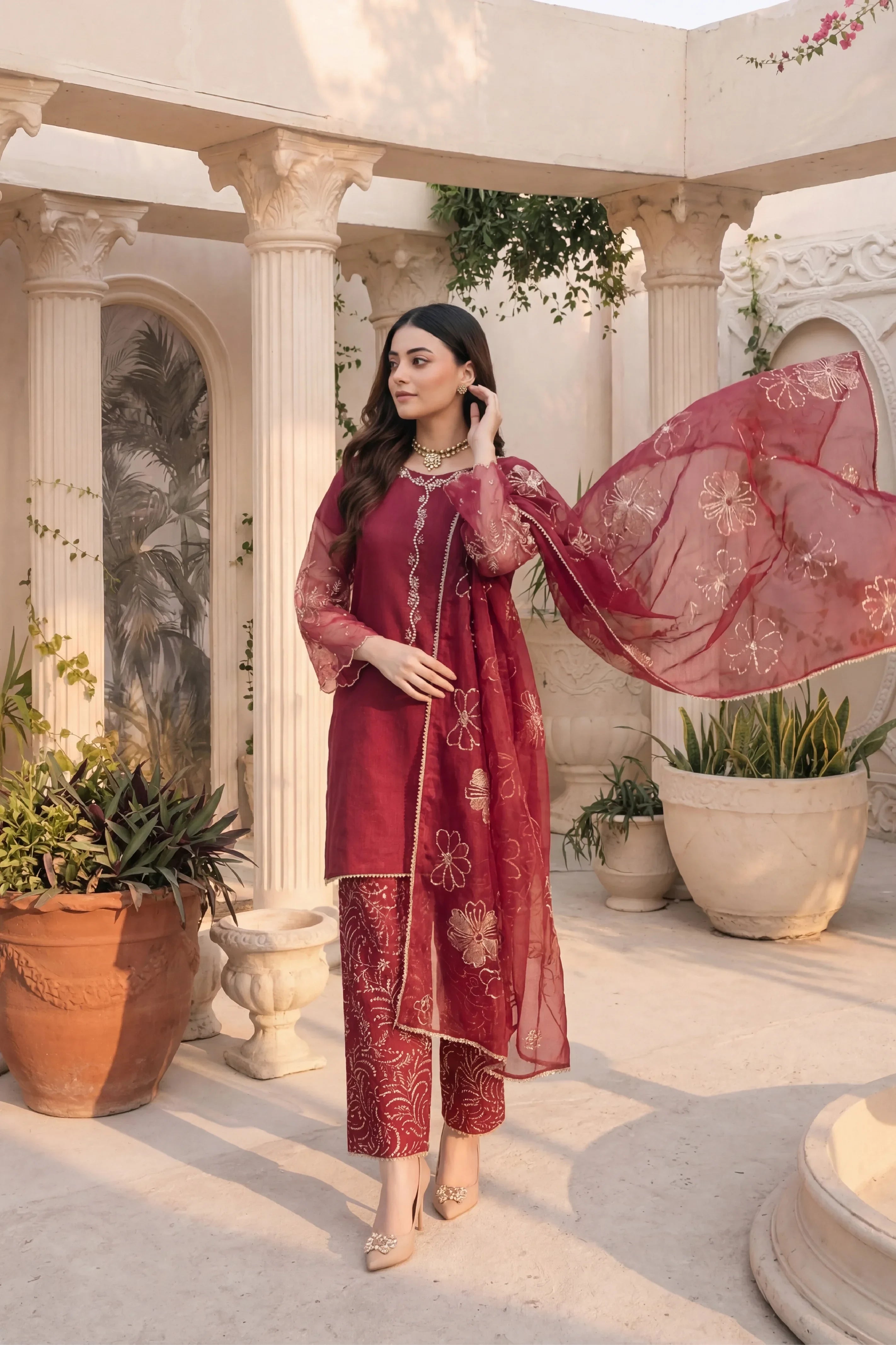 Elegant maroon embroidered Pakistani suit with floral dupatta, perfect for formal occasions and weddings.