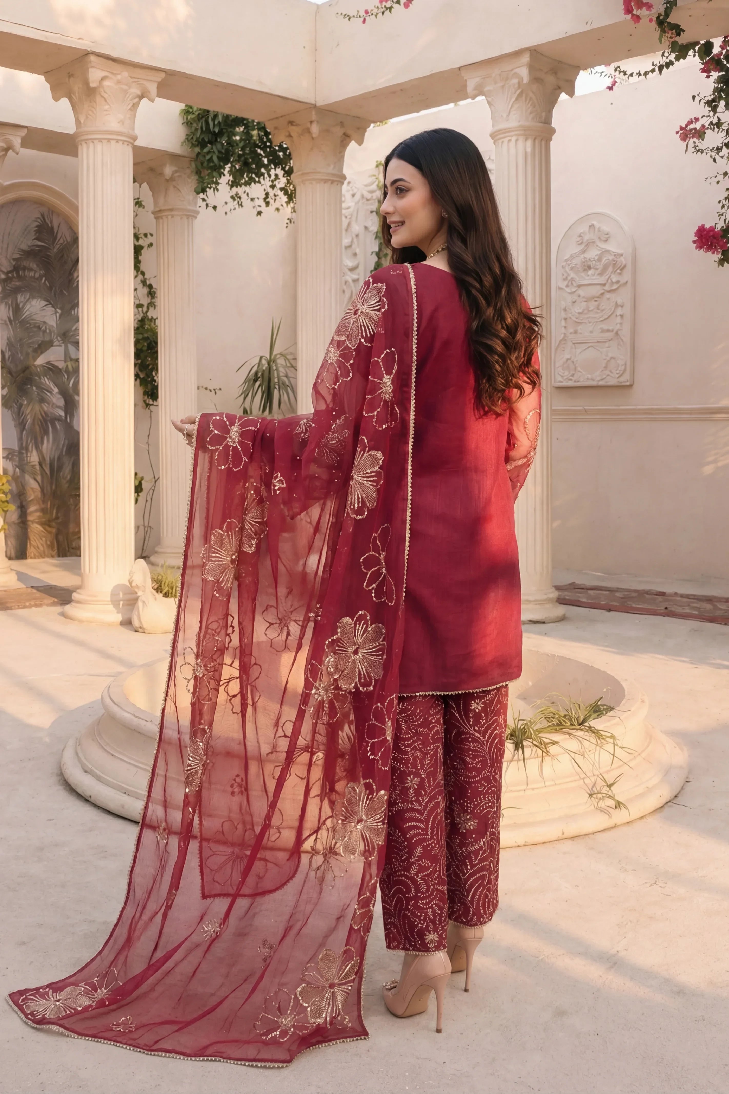 Elegant maroon embroidered Pakistani suit with floral dupatta, perfect for festive occasions and weddings.