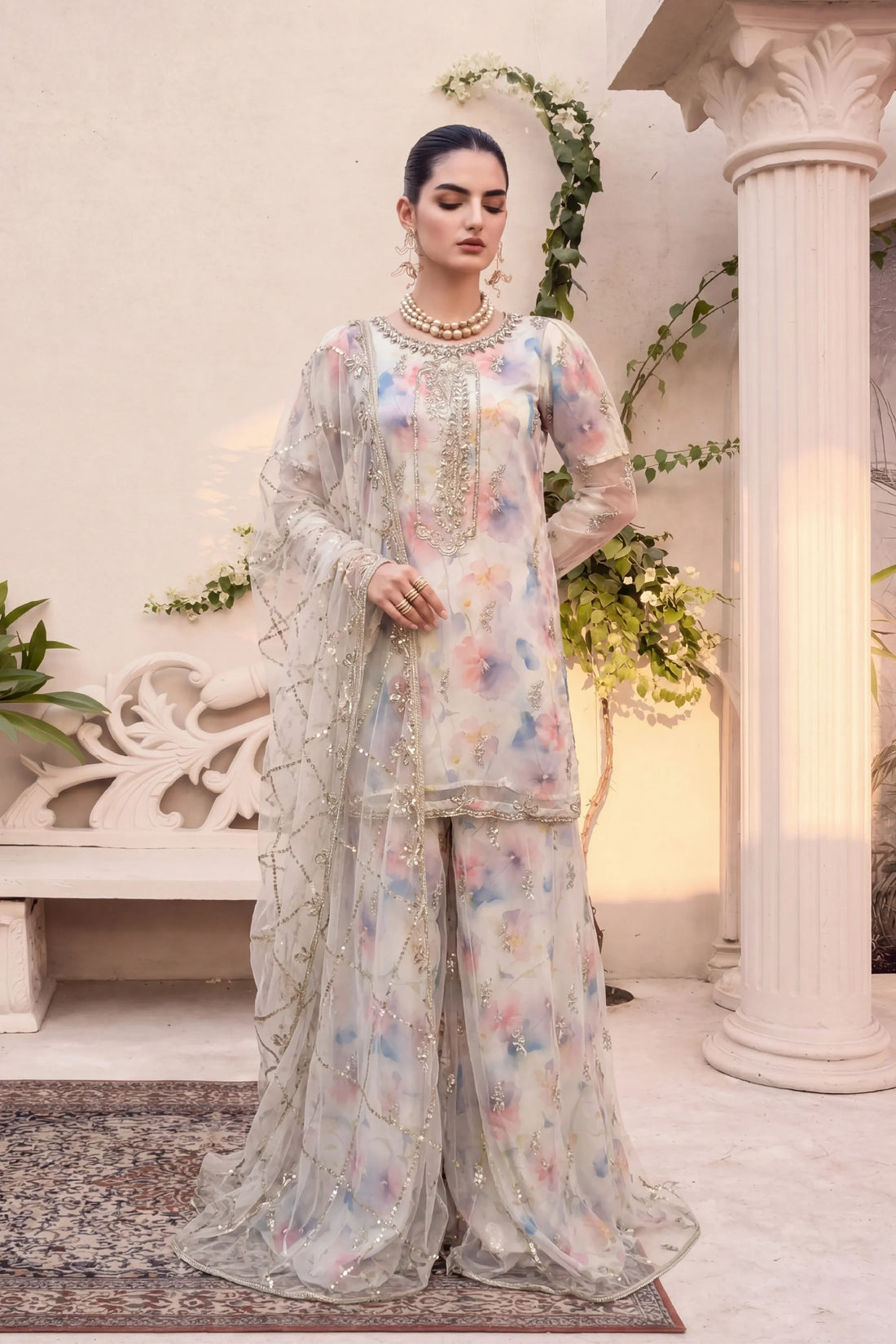 Elegant floral printed stitched dress with gold embroidery, perfect for Pakistani women&