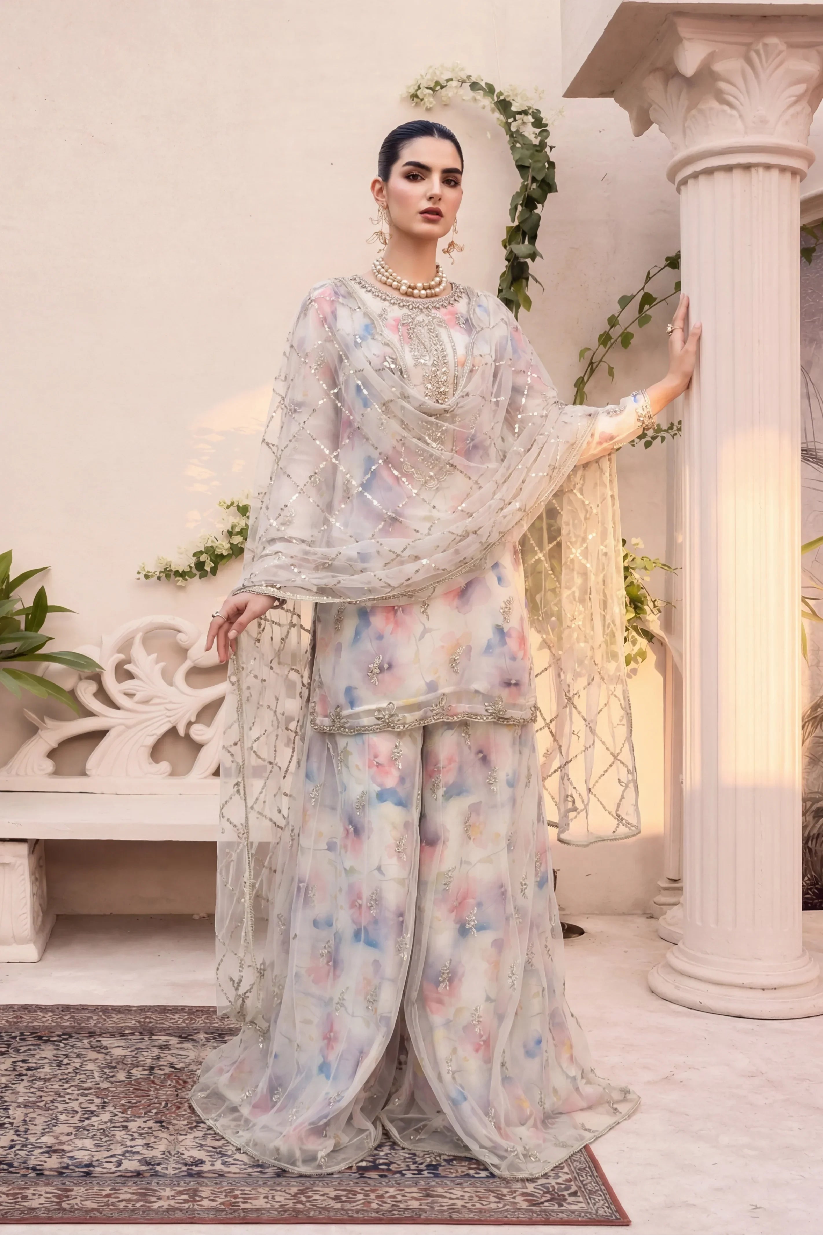Elegant floral embroidered Pakistani suit with sequin dupatta, perfect for weddings and special occasions.