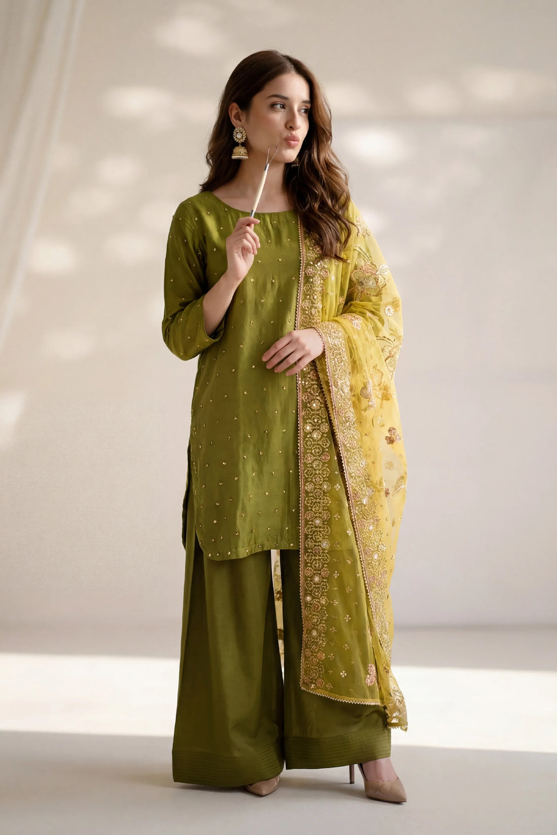 Olive green embroidered Pakistani suit with floral dupatta, elegant women&