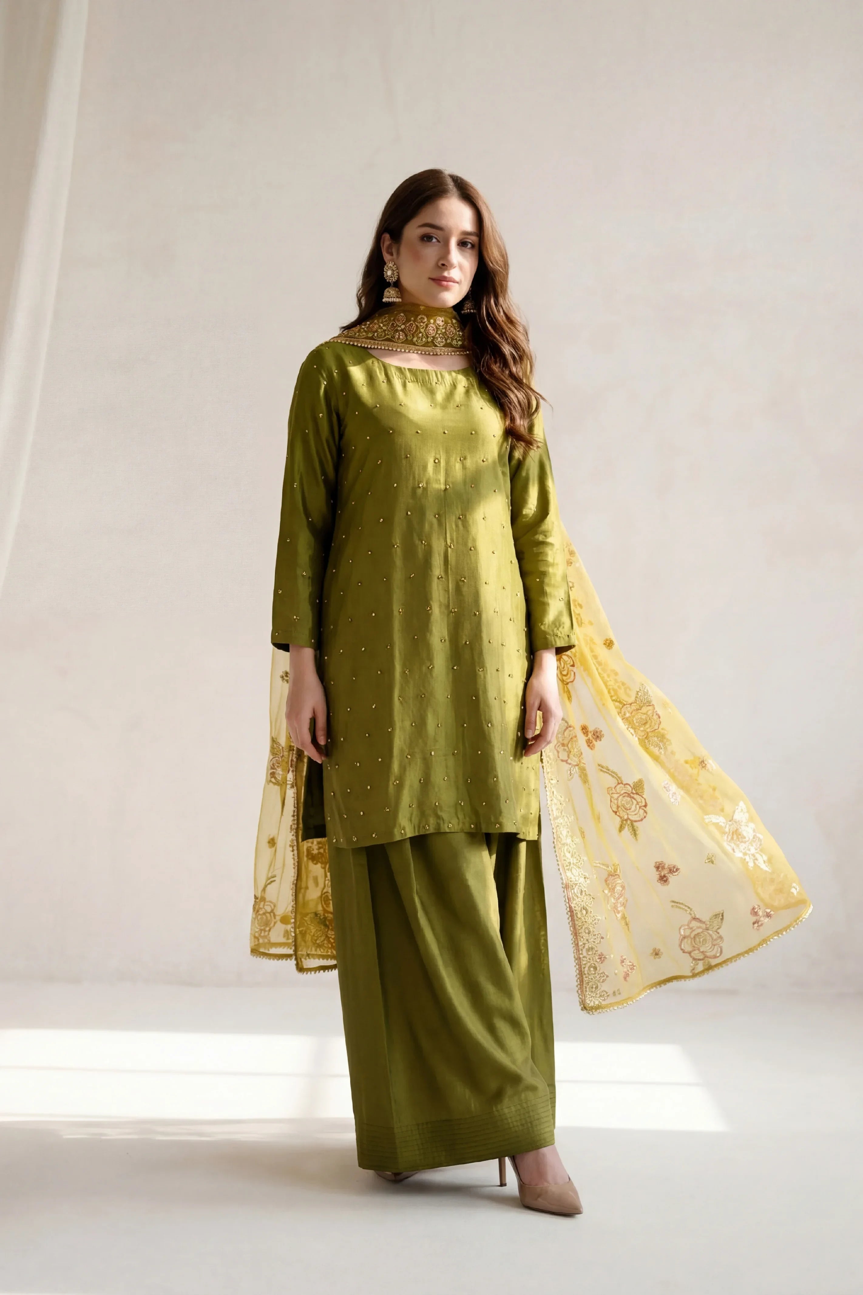 Olive green embroidered Pakistani suit with floral dupatta, elegant women&
