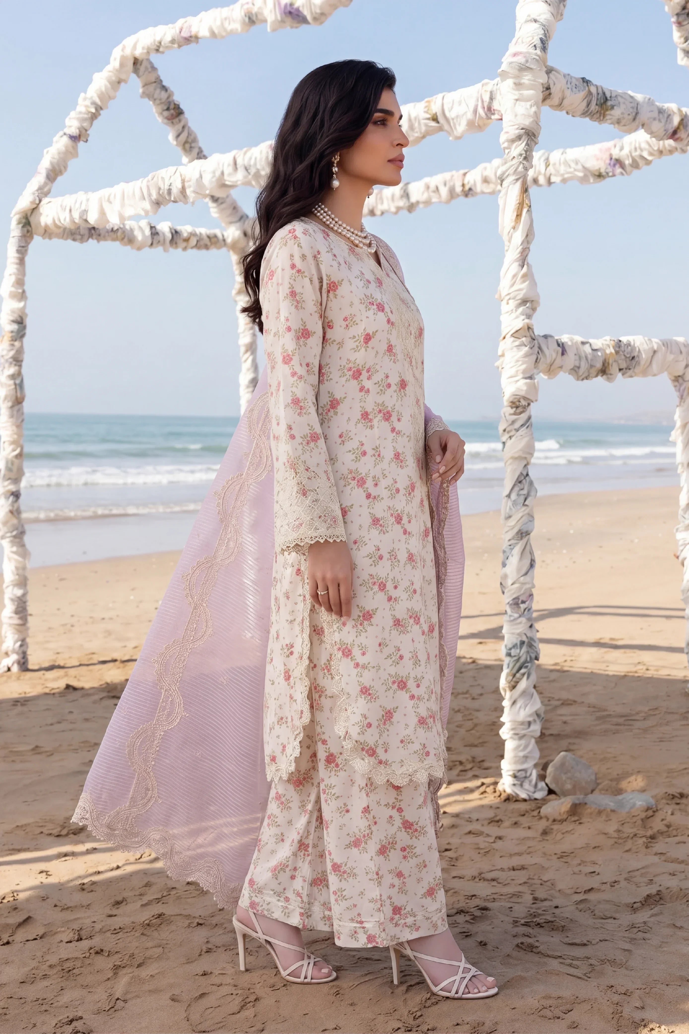 Elegant floral printed dress with lace detailing, paired with a soft dupatta, perfect for beachside elegance.