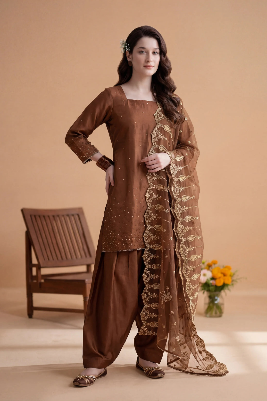 Brown embroidered Pakistani suit with gold detailing, elegant stitched dress for women