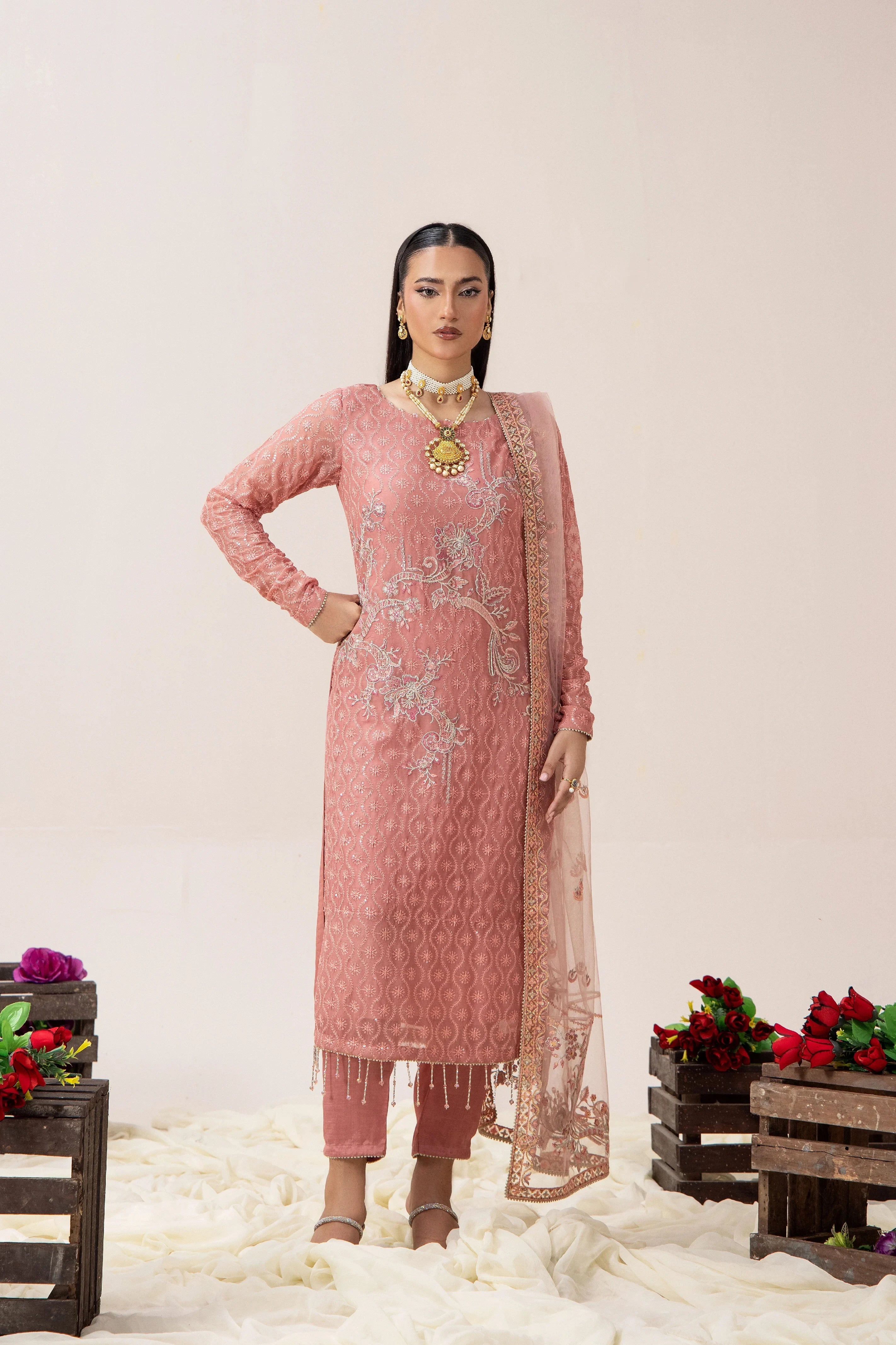 Elegant pink embroidered Pakistani dress with matching dupatta, perfect for weddings and special occasions.