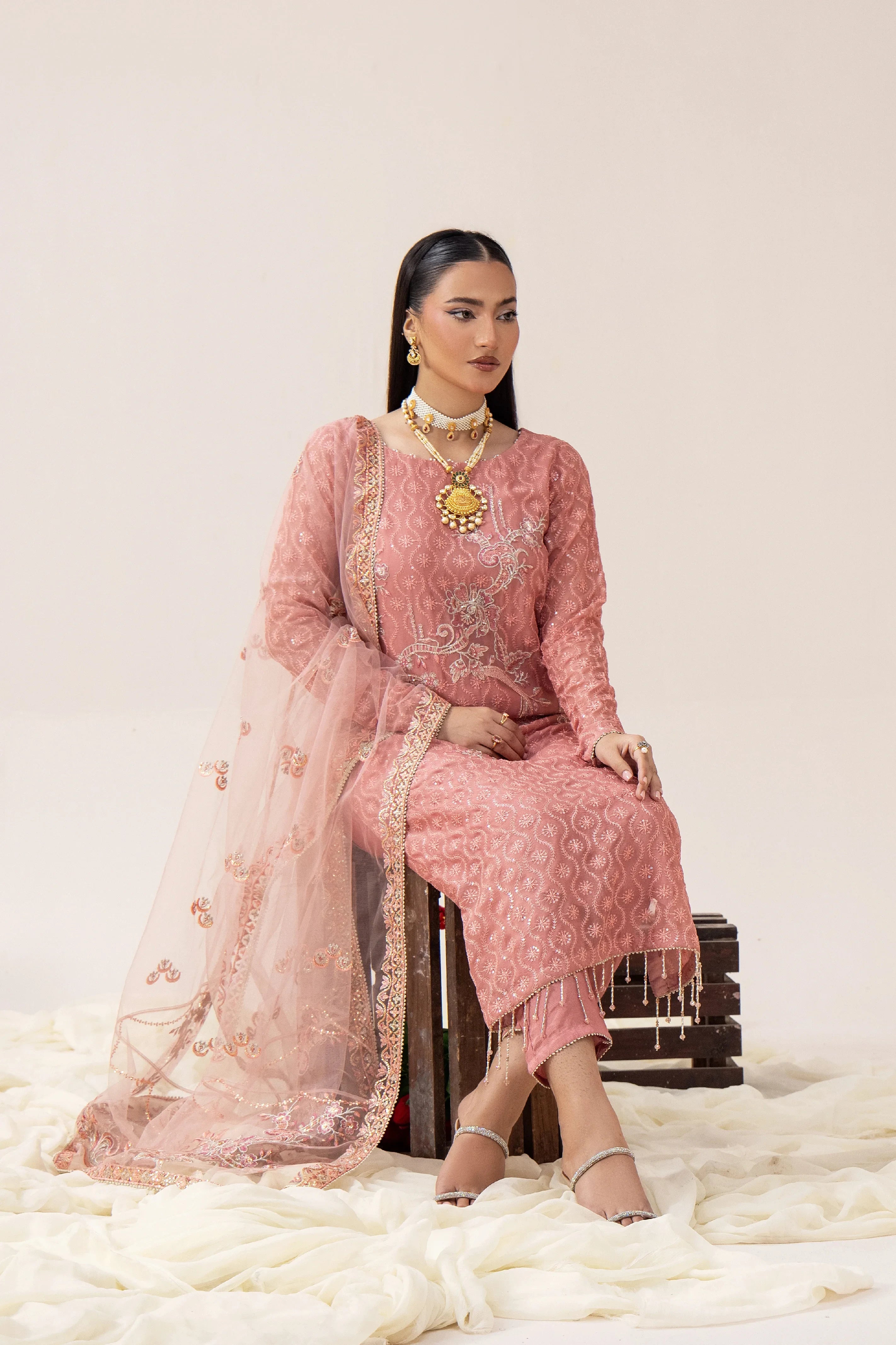 Elegant pink embroidered Pakistani suit with dupatta, perfect for weddings and formal occasions.