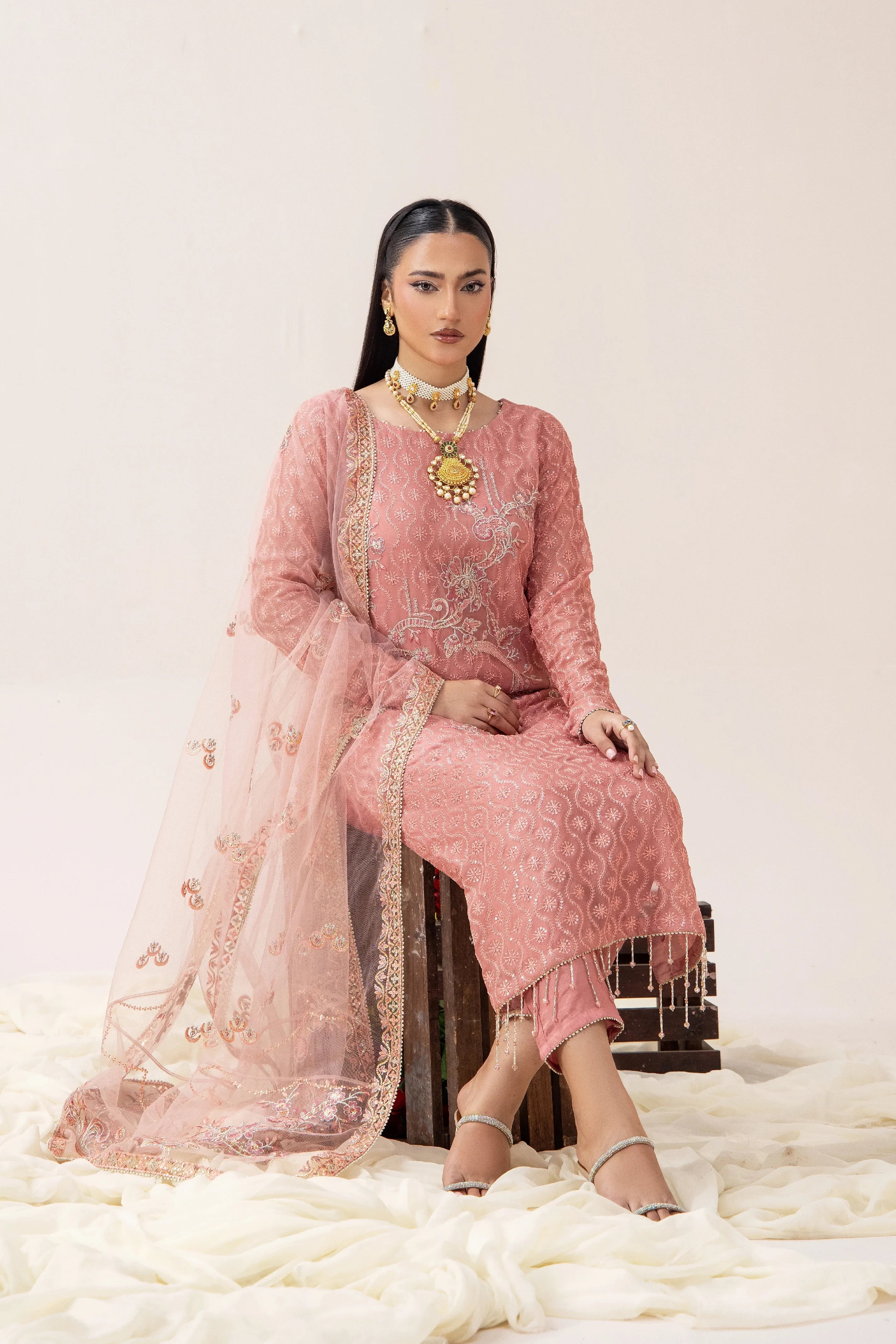 Elegant pink embroidered Pakistani suit with dupatta, perfect for weddings and formal occasions.