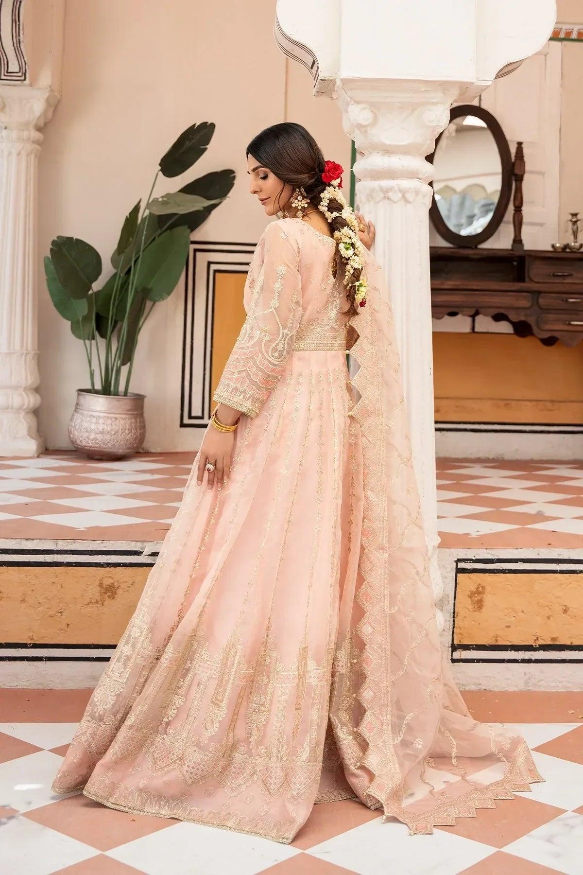 Elegant pink embroidered anarkali dress with gold detailing, perfect for weddings and special occasions in Pakistan.