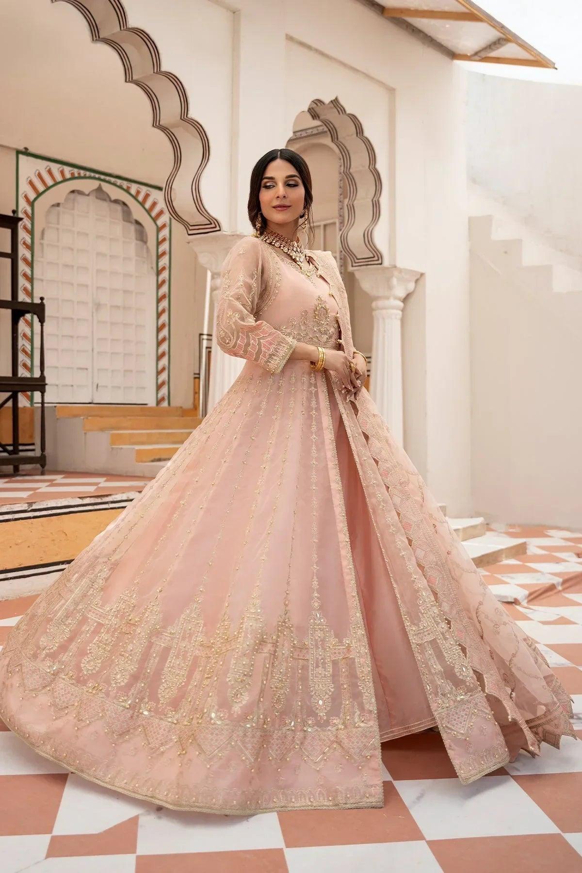 Elegant blush pink embroidered anarkali dress with gold detailing, perfect for weddings and special occasions in Pakistan.