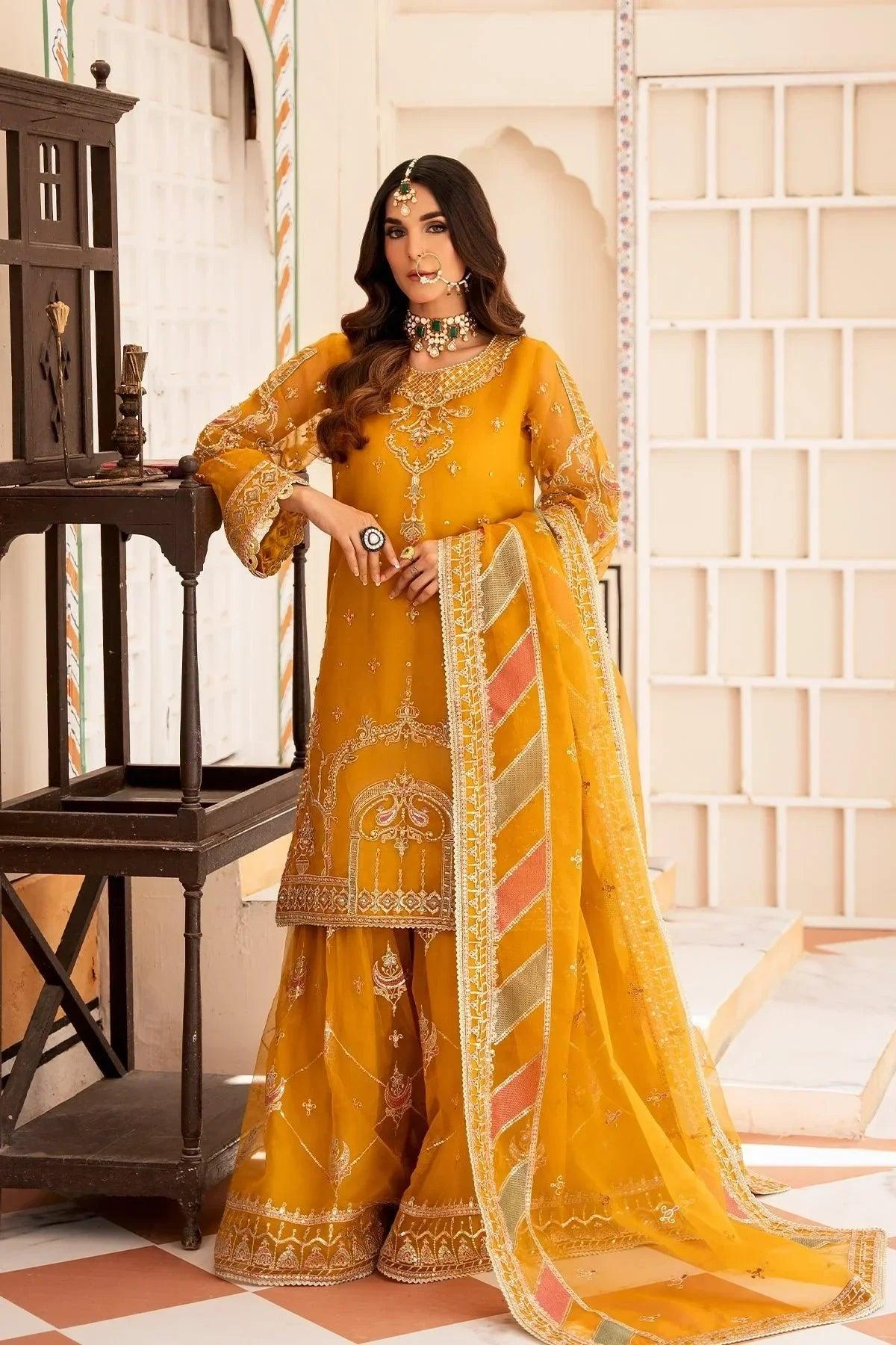 Elegant mustard yellow embroidered Pakistani dress with matching dupatta, perfect for festive occasions.