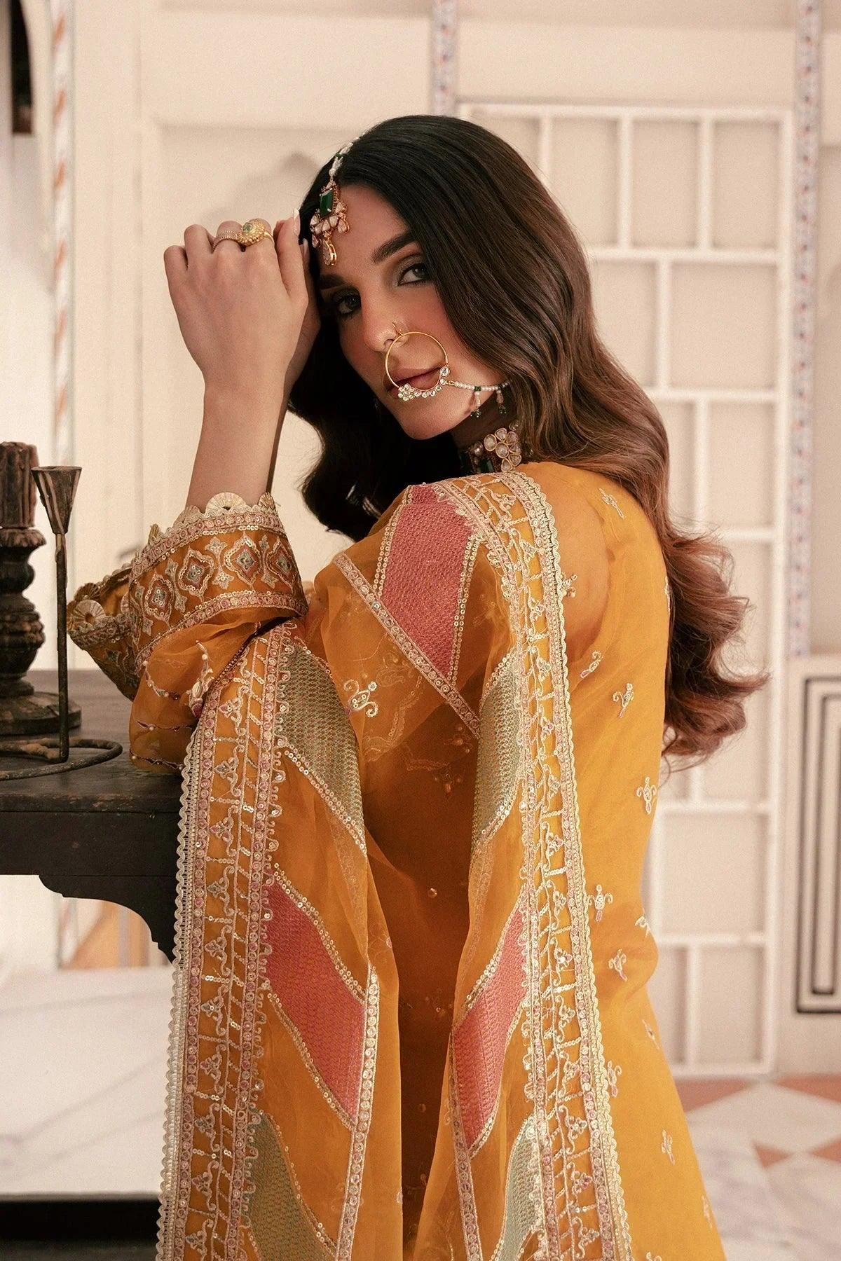 Elegant mustard yellow embroidered dress with pink panels, perfect for Pakistani women&