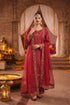 Elegant maroon Pakistani dress with gold embroidery, perfect for weddings and festive occasions.