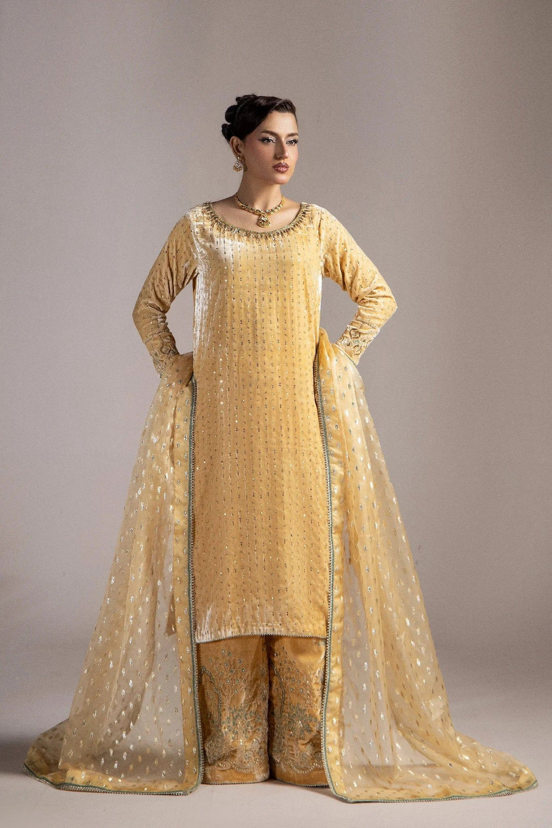 Elegant gold embroidered Pakistani dress with matching dupatta, perfect for weddings and special occasions.
