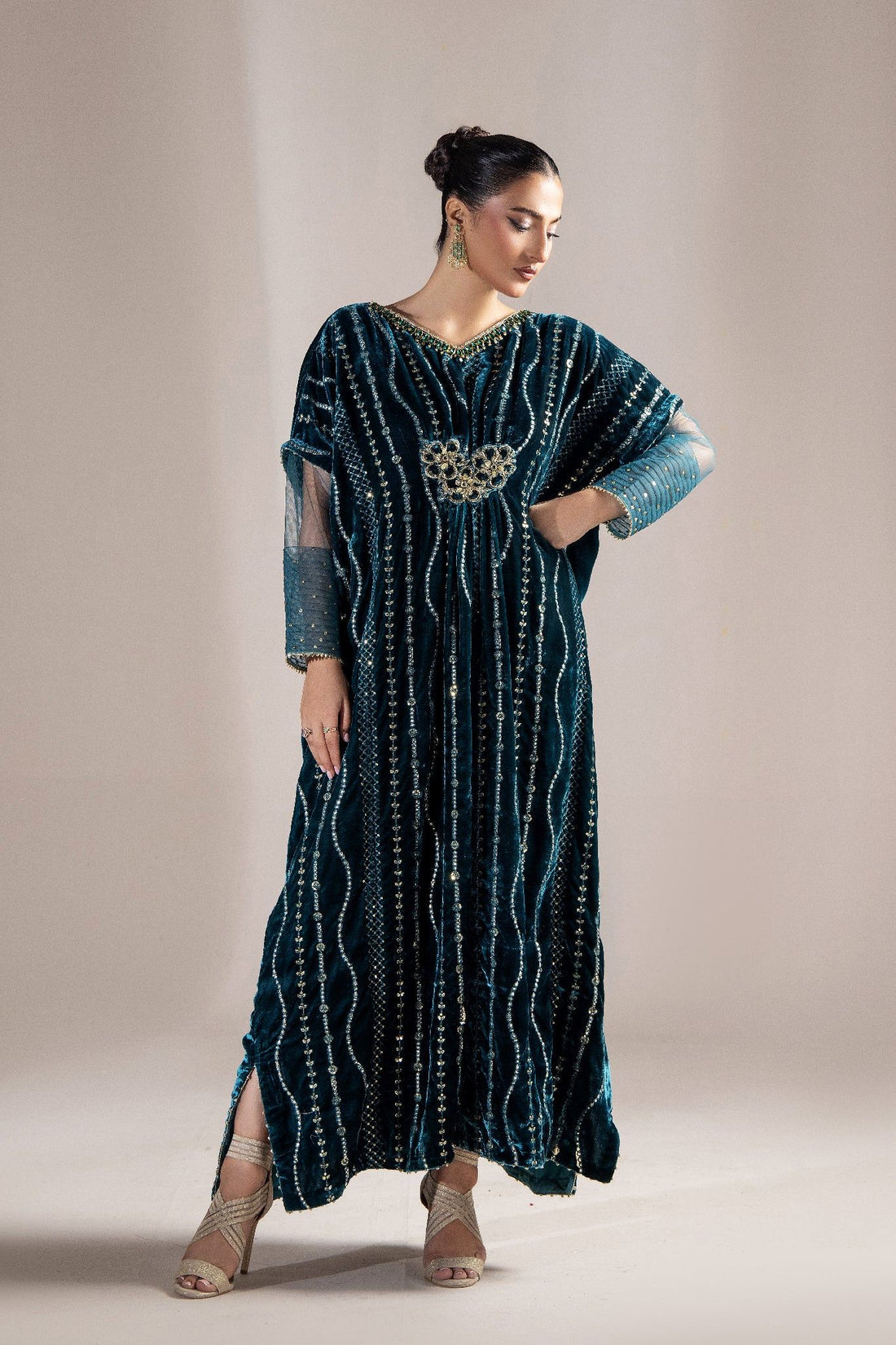 Elegant teal velvet kaftan with gold embroidery, perfect for evening events and special occasions.