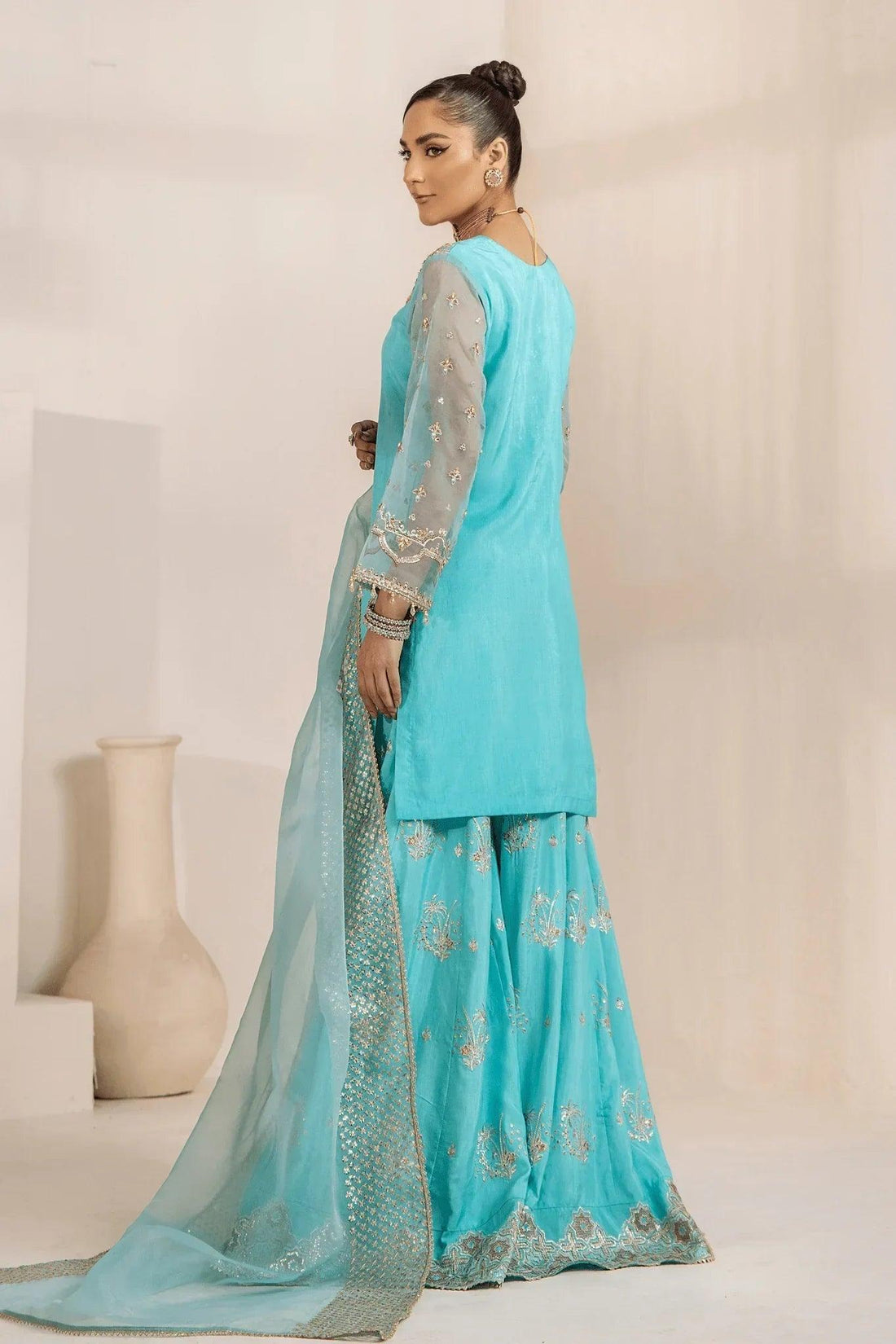 Elegant turquoise embroidered shalwar kameez with sheer sleeves and dupatta, perfect for Pakistani women&