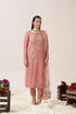 Elegant pink embroidered Pakistani suit with floral motifs, paired with matching dupatta and pants, styled for festive occasions.