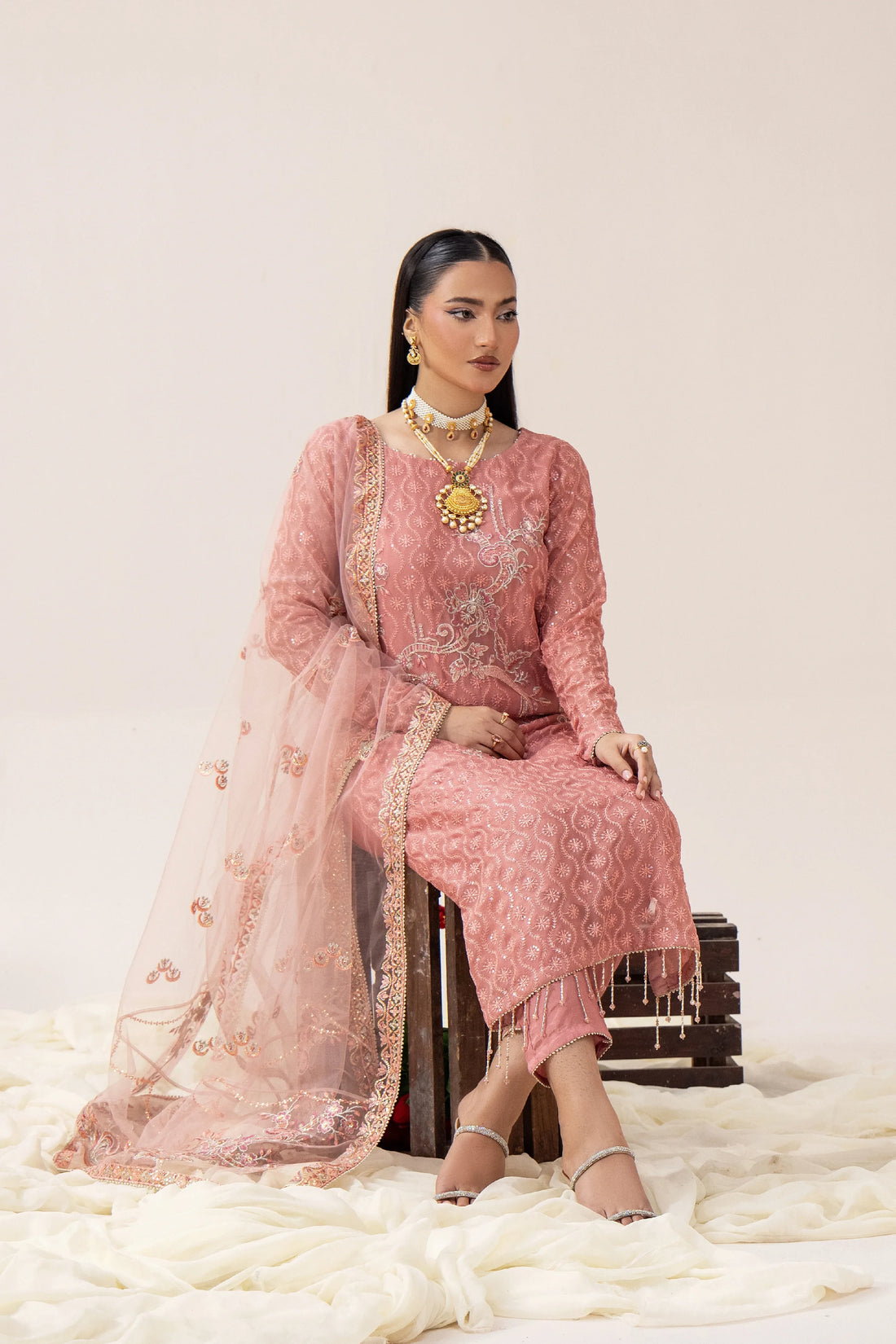 Elegant pink embroidered Pakistani suit with dupatta, perfect for weddings and formal occasions.