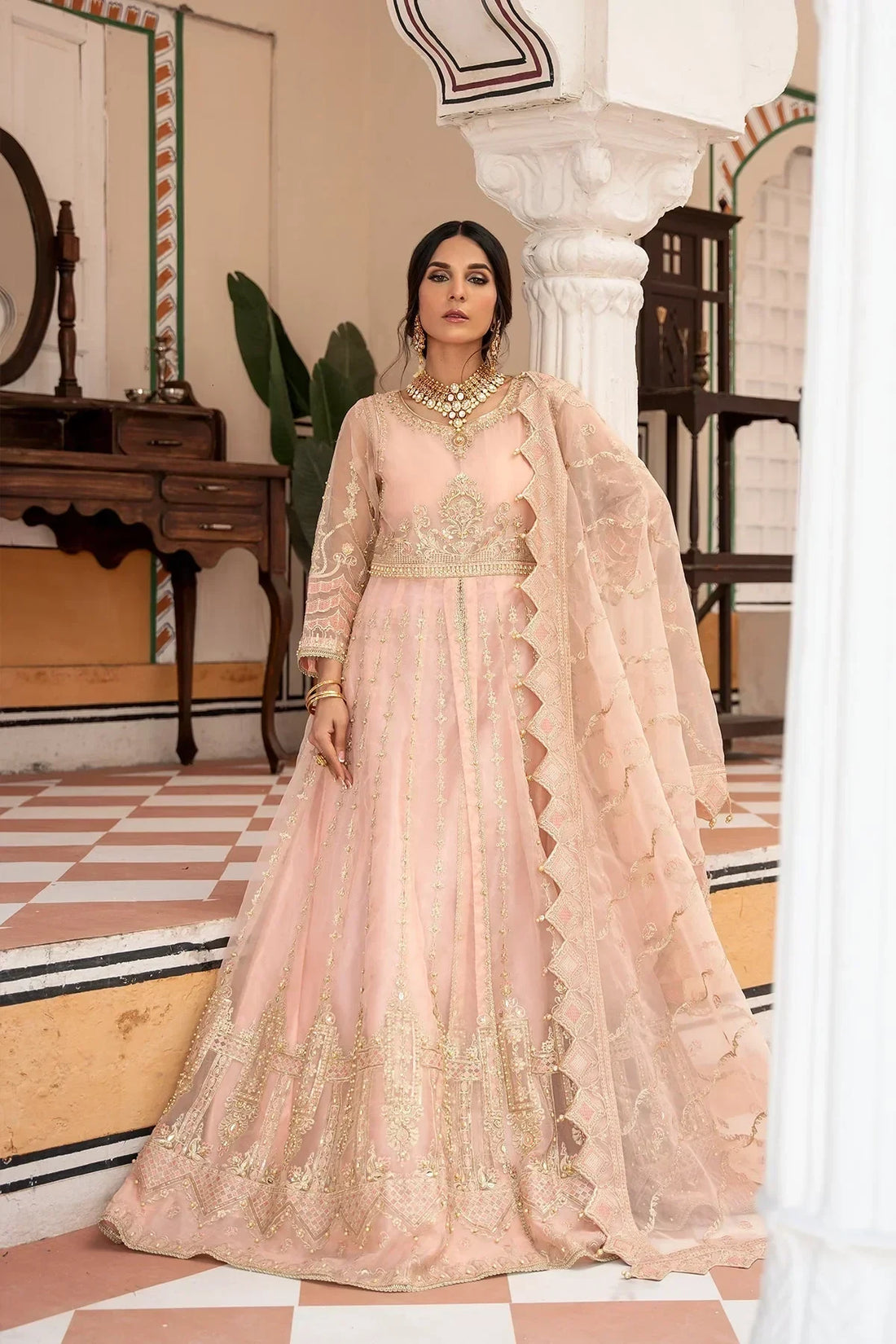 Elegant blush pink embroidered anarkali with gold detailing, perfect for weddings and special occasions in Pakistan.