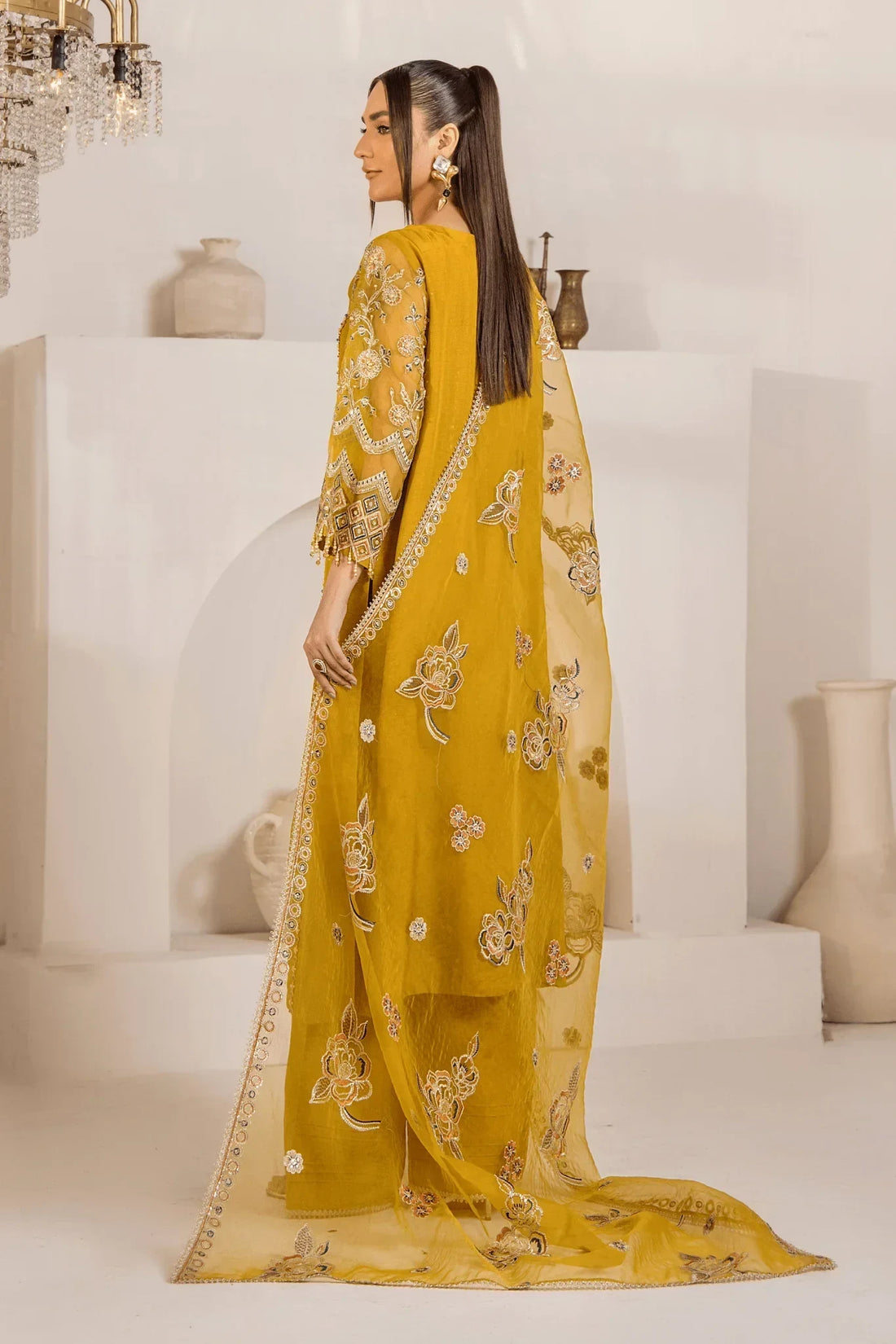 Mustard yellow embroidered Pakistani dress with floral motifs and sheer dupatta, elegant for special occasions