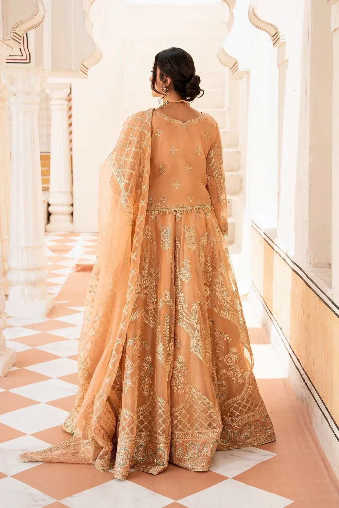 Elegant peach embroidered anarkali suit with dupatta, perfect for weddings and special occasions in Pakistan