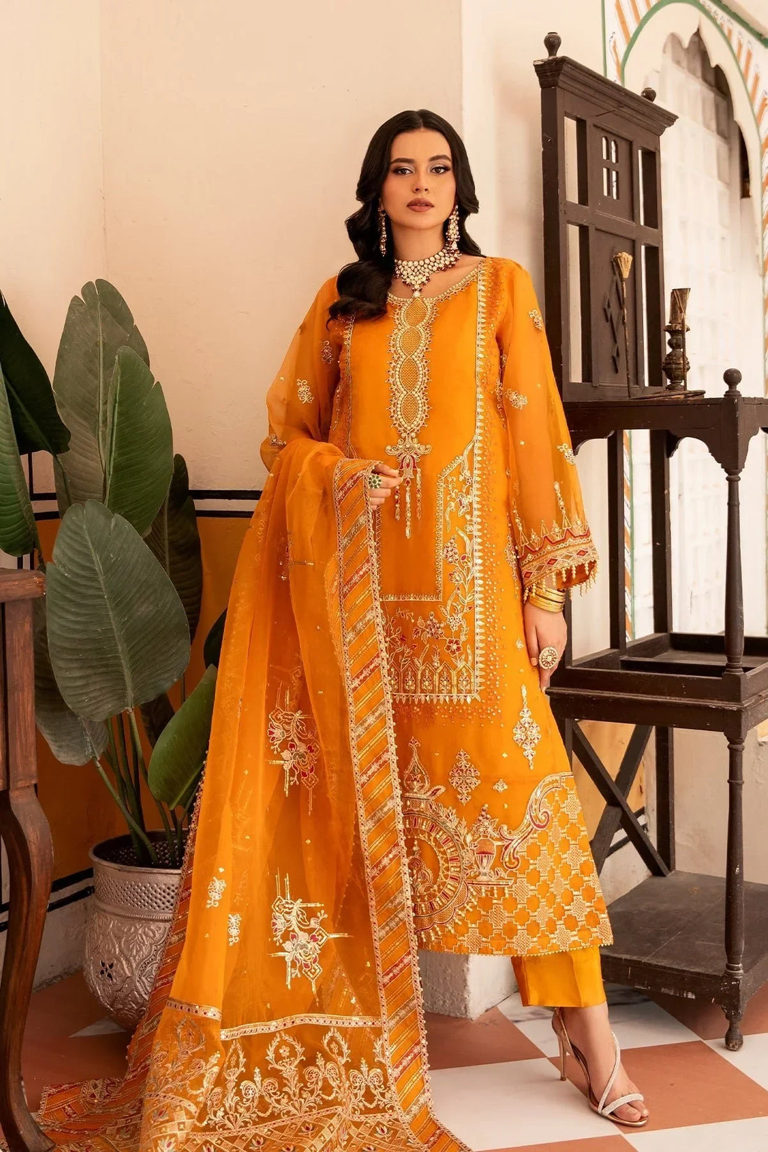 Elegant orange embroidered Pakistani dress with matching dupatta, perfect for festive occasions